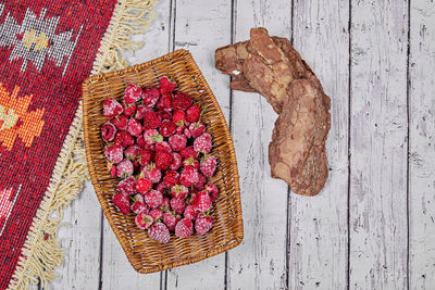 High angle view of fruits in basket on table