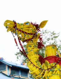 Low angle view of statue against sky