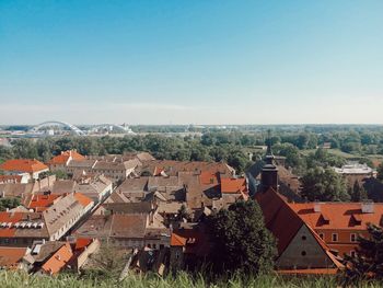 High angle view of townscape against clear blue sky