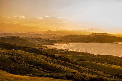 Scenic view of landscape against sky during sunset