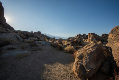 Rock formations on landscape against clear sky in desert landscape