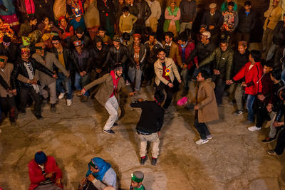 High angle view of people standing on street