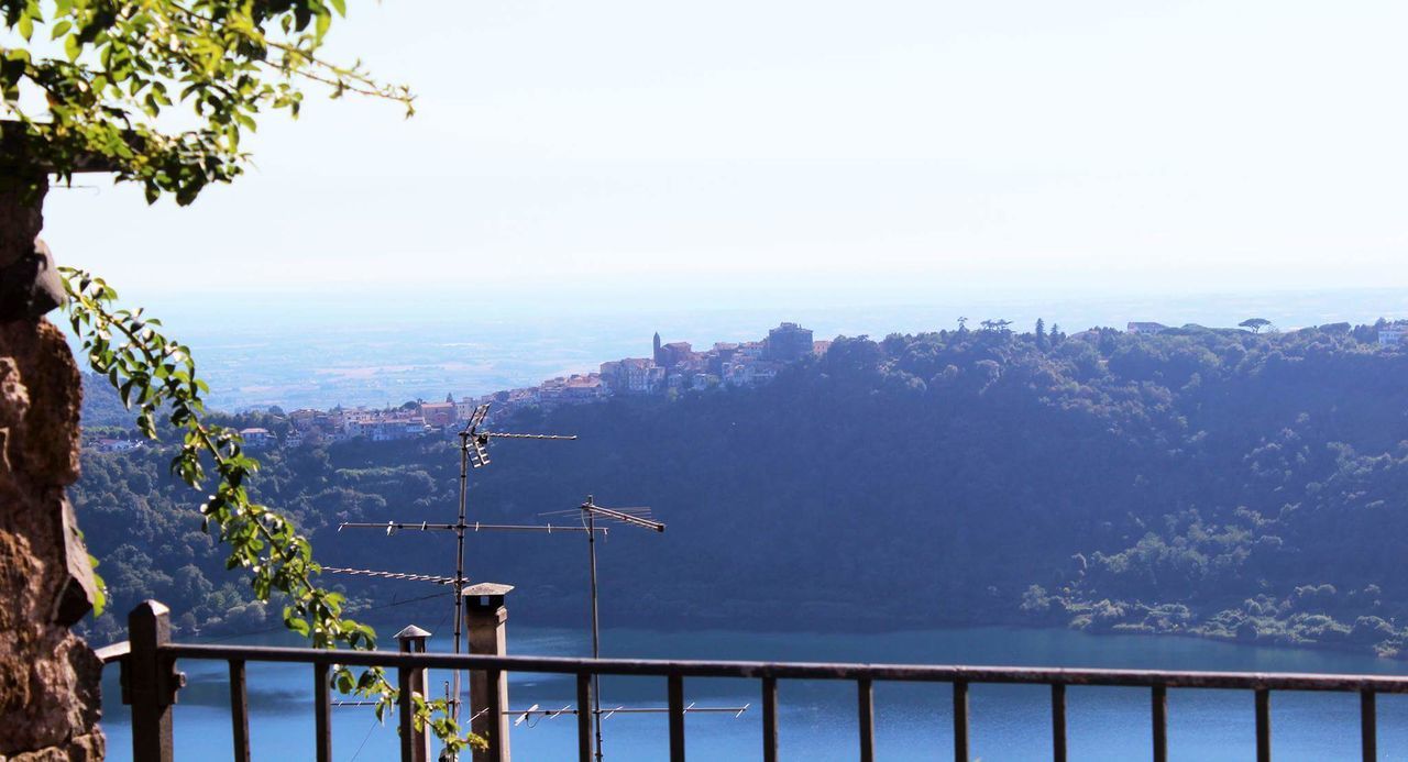 SCENIC VIEW OF SEA WITH MOUNTAIN IN BACKGROUND