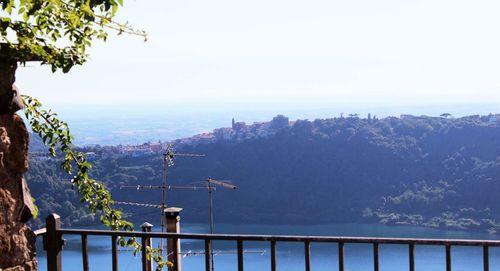 Scenic view of sea with mountain in background