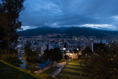 High angle view of illuminated buildings in city against sky