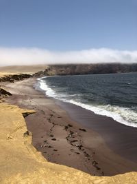 Scenic view of beach against sky in playa el raspon, paracas