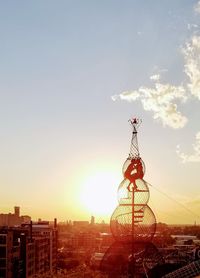 Cityscape against sky during sunset