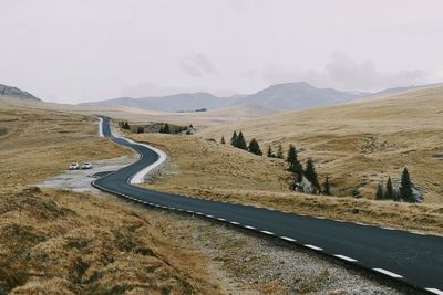 Road amidst landscape against sky