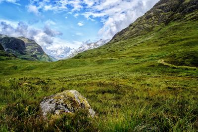 Scenic view of landscape and mountains against sky