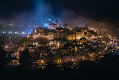 High angle view of illuminated buildings in city at night