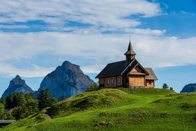 View of an old wooden church in the swiss mountains on lake lucerne.