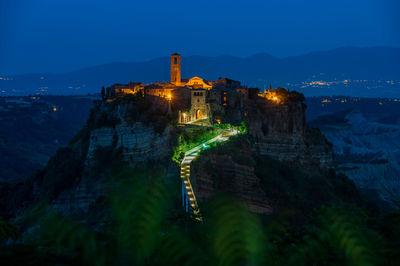 The ancient village of civita di bagnoregio, also called the diying city, in italy, at the blue hour