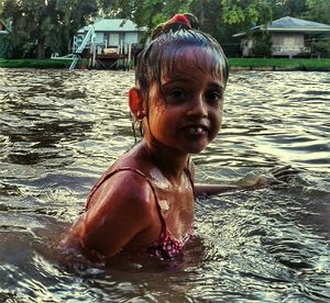 Portrait of smiling boy in water