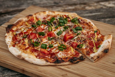 Close-up of pizza on cutting board