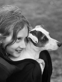 Portrait of young woman with dog