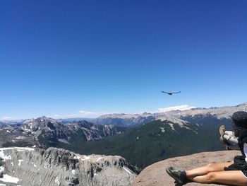 Scenic view of snowcapped mountains against clear blue sky