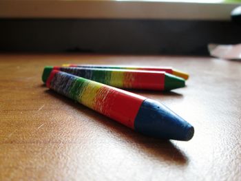 Close-up of crayons on table