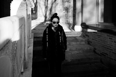 Young woman walking on steps outdoors