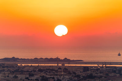 High angle view of sea against sky during sunset