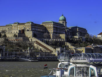 View of buildings against blue sky