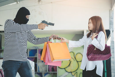 Woman standing by store