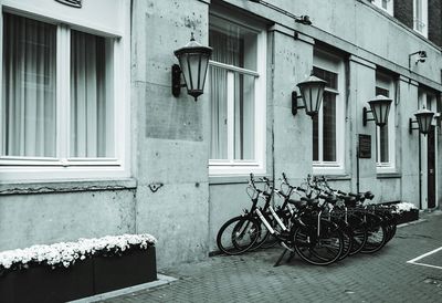 Bicycle parked against building