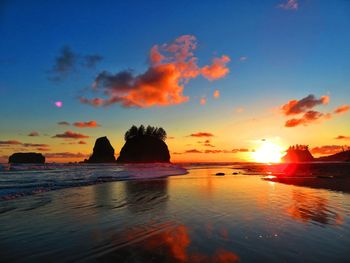 Scenic view of sea against romantic sky at sunset