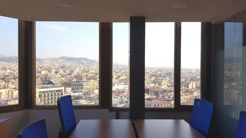 Close-up of cityscape against window