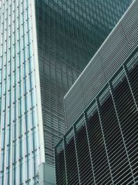 Low angle view of modern glass building in city