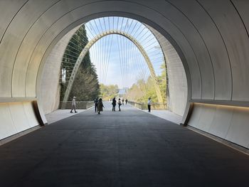 People walking in tunnel