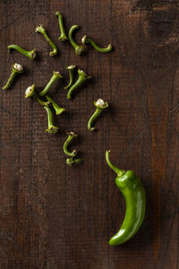 High angle view of green chili pepper on table