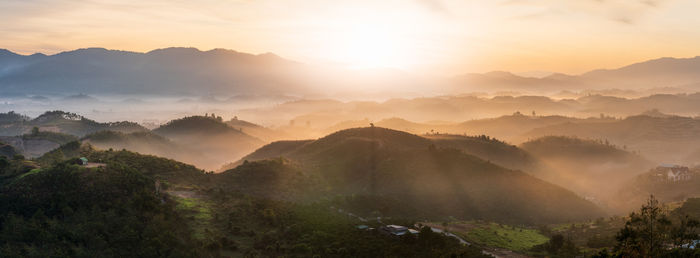 Panoramic view of mountains against sky during sunset