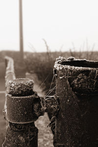 Close-up of rusty metal against sky