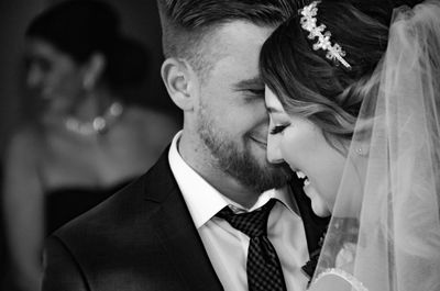 Midsection of man and woman holding hands