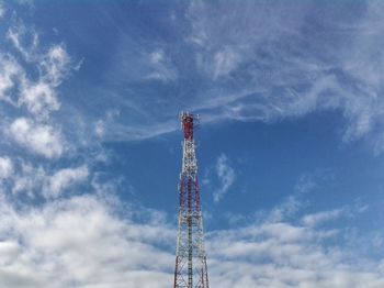 Low angle view of communications tower against sky