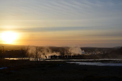 Scenic view of landscape against sky during sunset