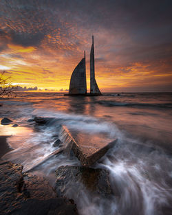 Scenic view of sea against sky during sunset