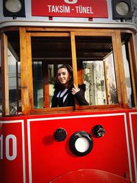 Portrait of smiling woman in bus