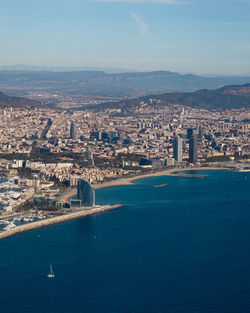 High angle view of barcelona city and sea against sky