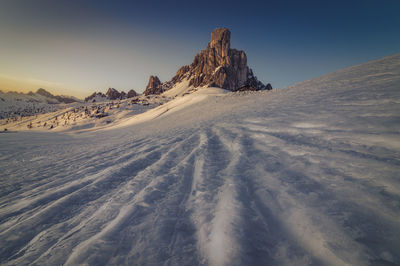 Scenic view of snowcapped mountains against clear sky