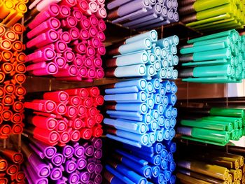 Full frame shot of colorful pens on shelf for sale in store