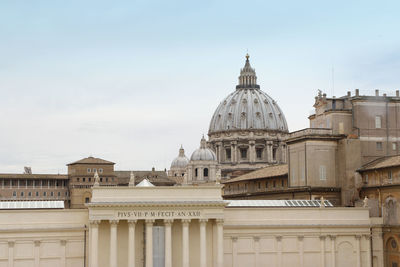 View of st peter basilica dome through a window from vatican museum