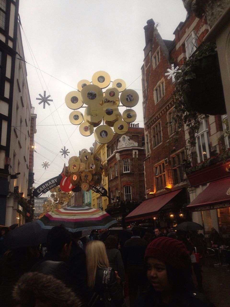 large group of people, men, building exterior, architecture, built structure, lifestyles, person, street, leisure activity, crowd, sky, city, city life, illuminated, clear sky, arts culture and entertainment, mixed age range, dusk, city street