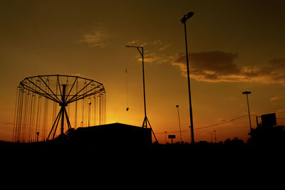 Silhouette street light against sky during sunset