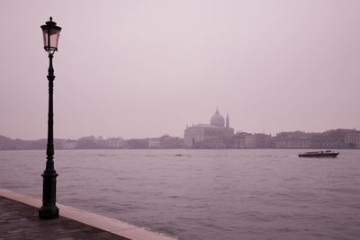 Evening soft light over venice, italy, city skyline, foggy day 