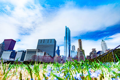 Panoramic view of modern buildings against blue sky