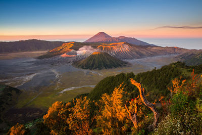 Scenic view of mountain range against sky during sunset