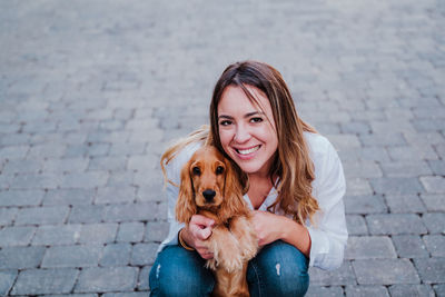 Portrait of woman with dog