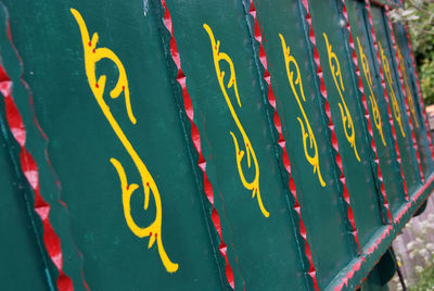 Close-up of yellow text on beach