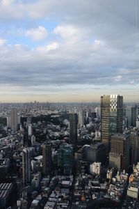 High angle view of modern buildings in city against sky